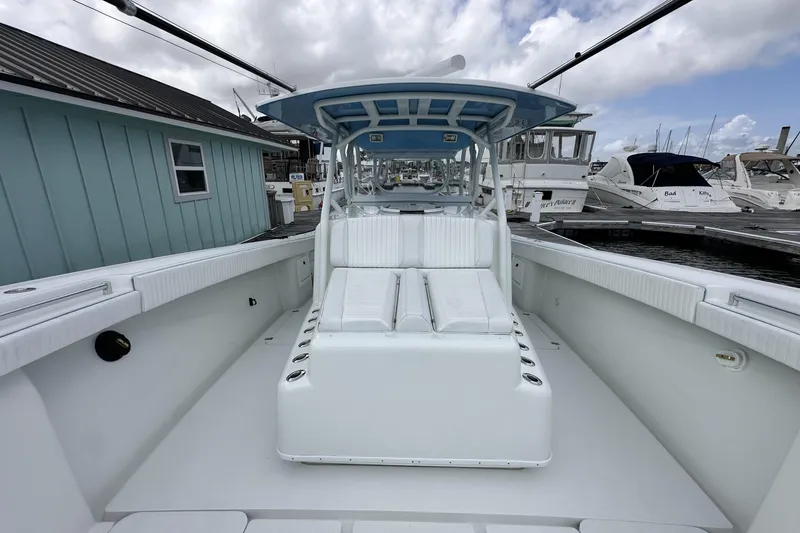 Slide: The Image of 2009 Yellowfin 42 Offshore boat with spacious deck and seating at marina. - 43