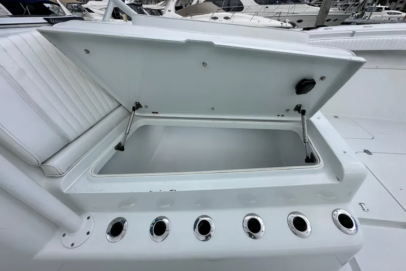 Slide: The Image of Open storage compartment on a 2009 Yellowfin 42 Offshore boat, showcasing sleek design and functionality. - 49