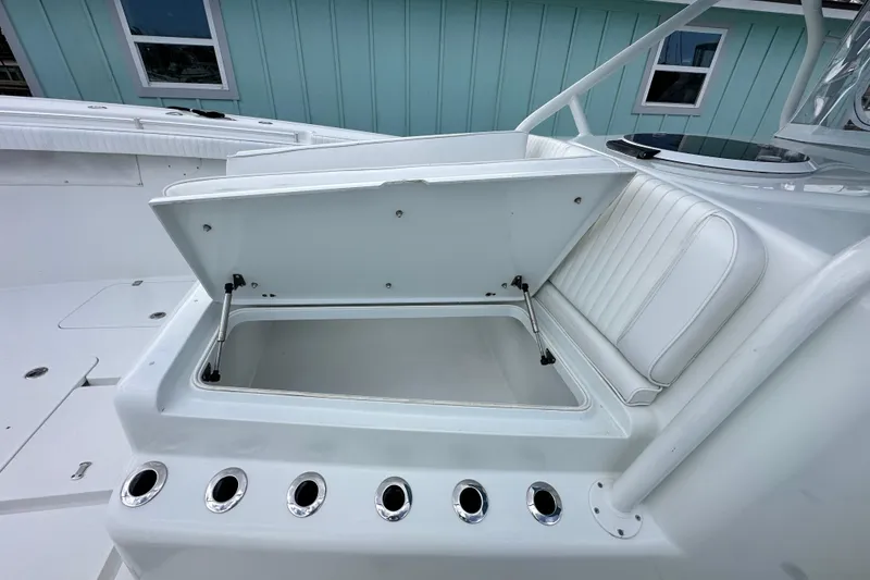 Slide: The Image of Open storage compartment on a 2009 Yellowfin 42 Offshore boat deck. - 50