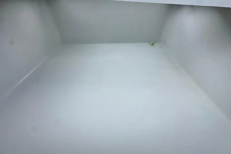 Slide: The Image of Empty storage compartment of 2009 Yellowfin 42 Offshore boat. - 51