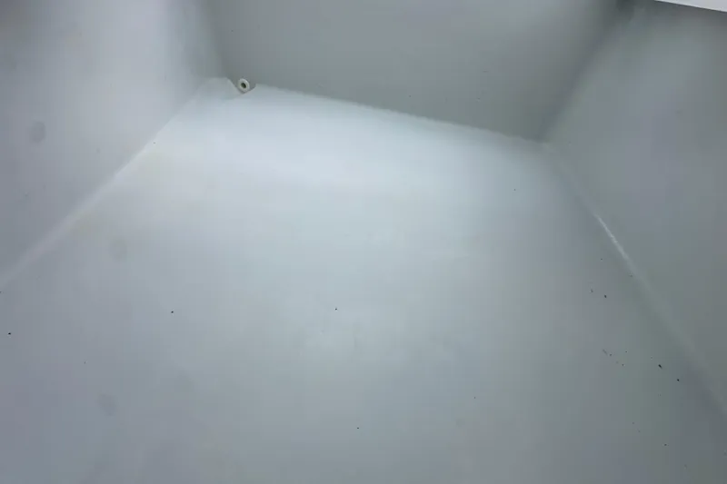 Slide: The Image of Empty storage compartment of 2009 Yellowfin 42 Offshore boat. - 52