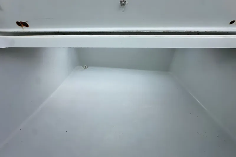 Slide: The Image of Empty storage compartment in a 2009 Yellowfin 42 Offshore boat. - 53