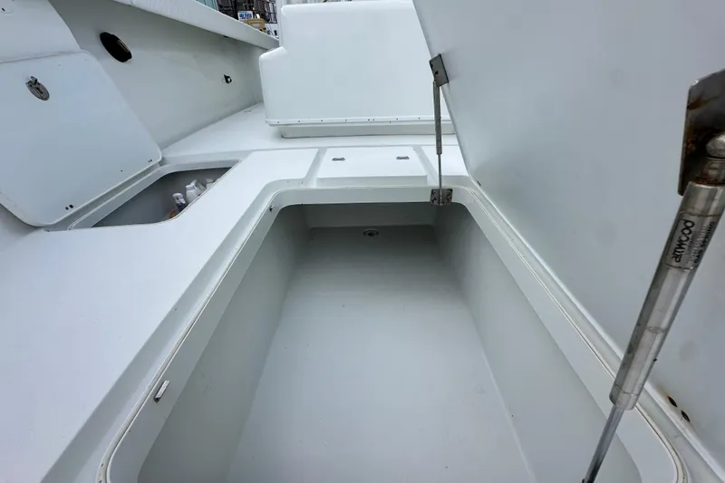 Slide: The Image of Open storage compartment on a 2009 Yellowfin 42 Offshore boat. - 57