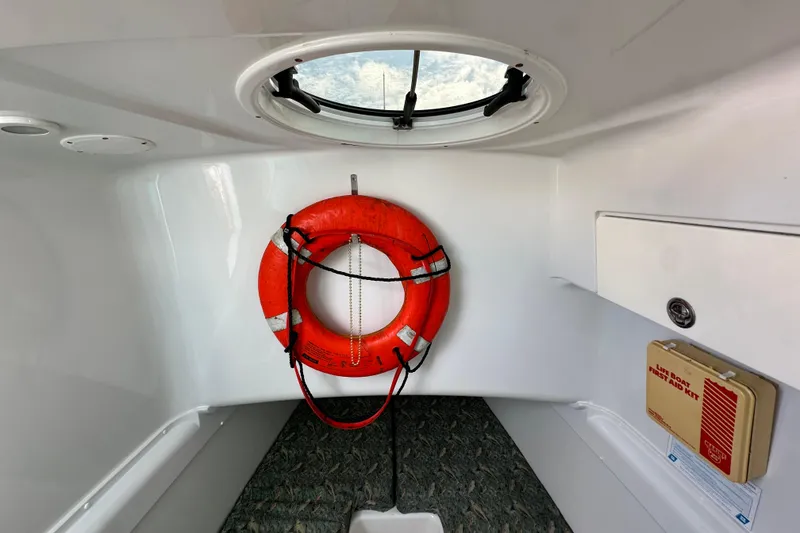 Slide: The Image of Interior of 2009 Yellowfin 42 Offshore boat with life preserver and first aid kit. - 63