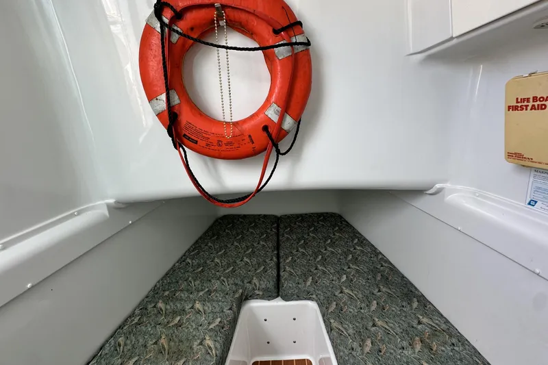 Slide: The Image of Interior of 2009 Yellowfin 42 Offshore boat with life preserver and first aid kit. - 64