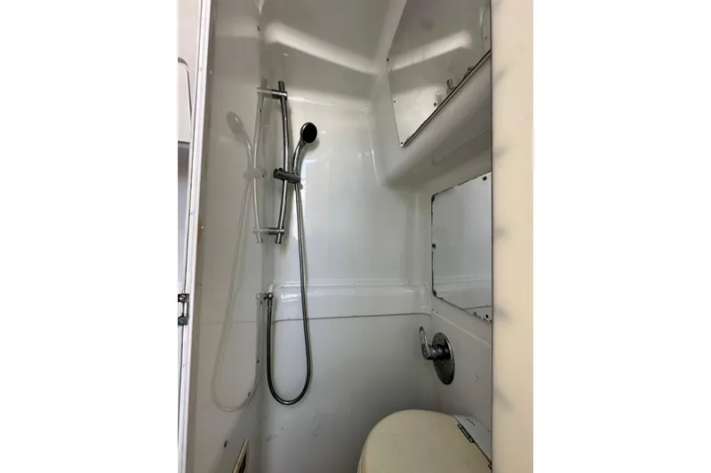 Slide: The Image of 2009 Yellowfin 42 Offshore boat bathroom with shower and toilet. - 68