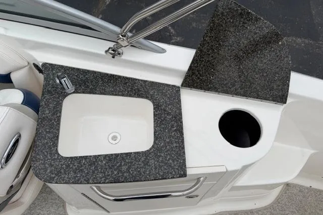 Slide: The Image of 2010 Chaparral Sunesta 244 boat sink and countertop detail. - 16