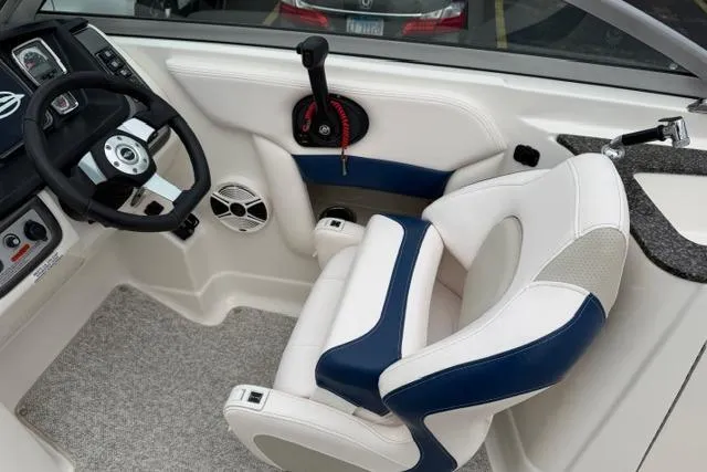 Slide: The Image of Cockpit of 2010 Chaparral Sunesta 244 boat with steering wheel and captain's chair. - 20