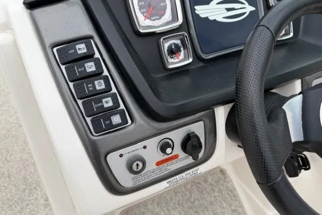 Slide: The Image of Dashboard controls of a 2010 Chaparral Sunesta 244 boat. - 22