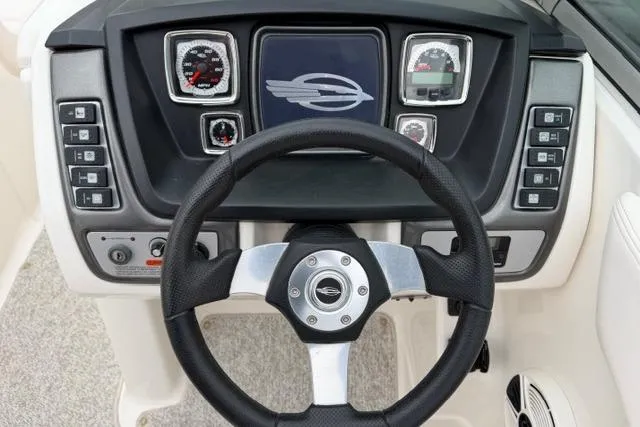 Slide: The Image of 2010 Chaparral Sunesta 244 dashboard with steering wheel and instrument panel. - 23