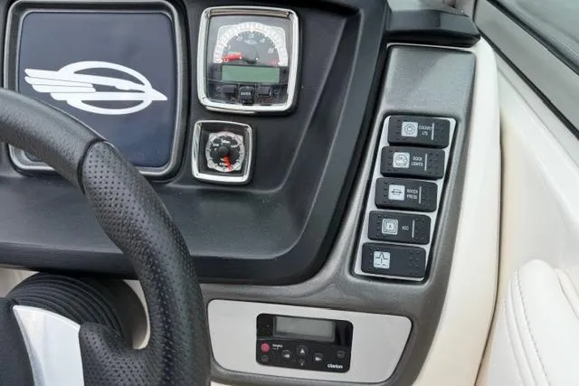 Slide: The Image of Dashboard of 2010 Chaparral Sunesta 244 boat with controls and gauges. - 25