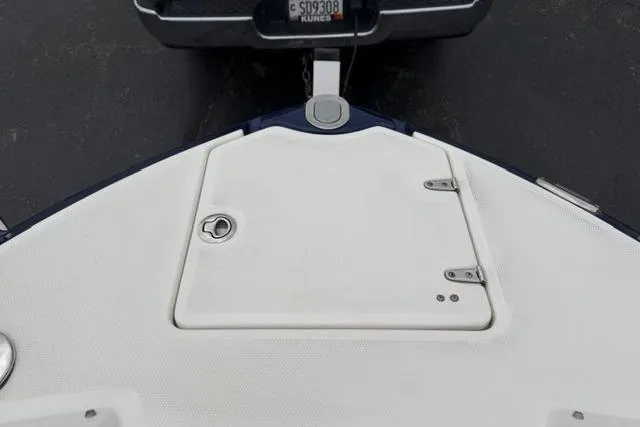 Slide: The Image of 2010 Chaparral Sunesta 244 boat bow with storage compartment and trailer hitch. - 34