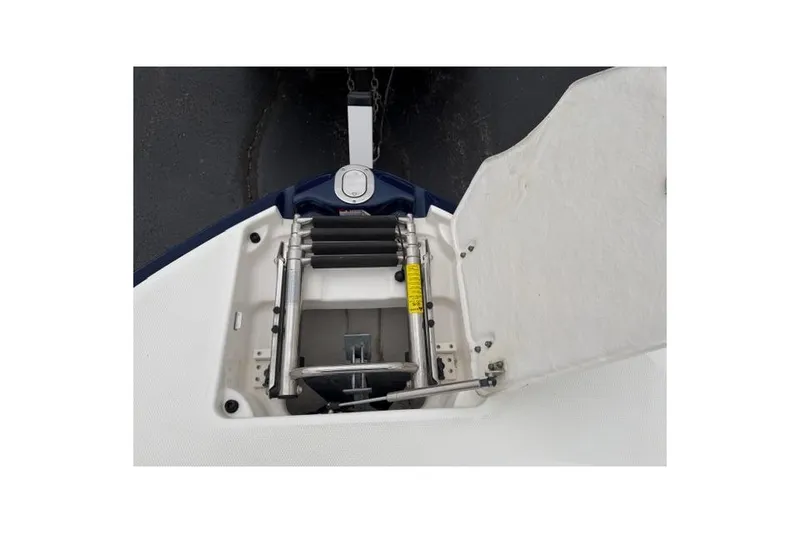Slide: The Image of 2010 Chaparral Sunesta 244 boat anchor compartment with ladder and chain. - 35