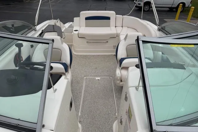 Slide: The Image of 2010 Chaparral Sunesta 244 boat interior with seating and steering wheel. - 40