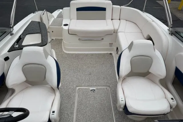 Slide: The Image of 2010 Chaparral Sunesta 244 boat interior with white seating and carpeted floor. - 42