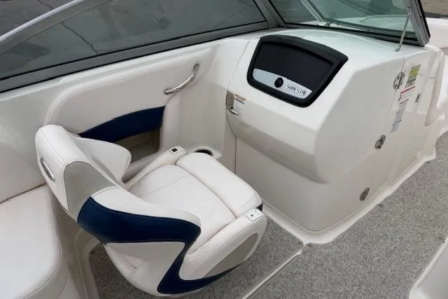 Slide: The Image of 2010 Chaparral Sunesta 244 boat interior with white and blue seating. - 44