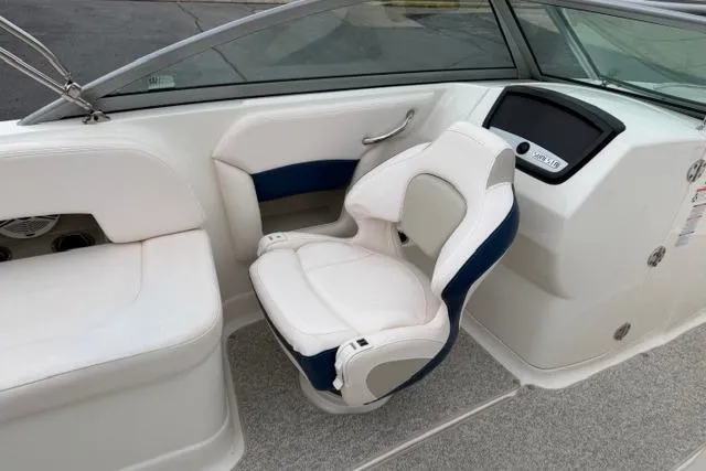 Slide: The Image of 2010 Chaparral Sunesta 244 boat interior with white and blue seating. - 47