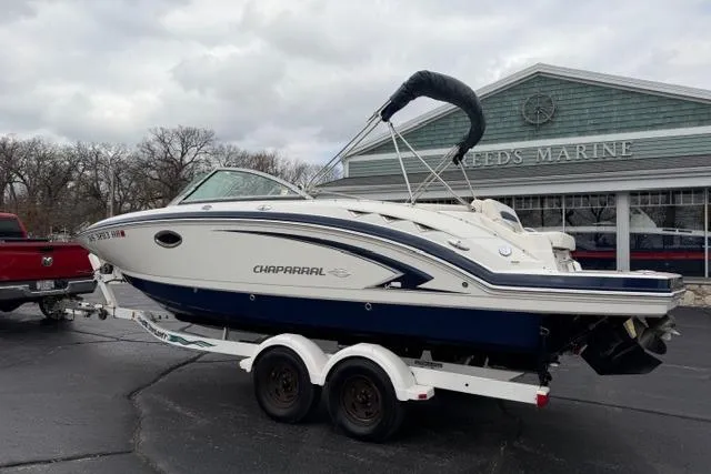 Slide: The Image of 2010 Chaparral Sunesta 244 boat on trailer at Reed's Marine dealership. - 5