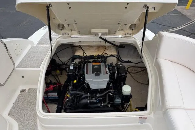 Slide: The Image of 2010 Chaparral Sunesta 244 boat engine compartment with open hatch. - 52