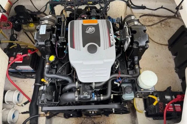Slide: The Image of Engine compartment of a 2010 Chaparral Sunesta 244 boat, featuring a MerCruiser 350 engine. - 53