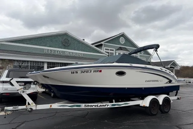 Slide: The Image of 2010 Chaparral Sunesta 244 boat on trailer at Reeds Marine dealership. - 54