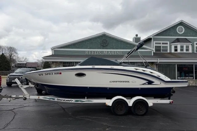Slide: The Image of Chaparral Sunesta 244 boat, 2010 model, on trailer at Reeds Marine dealership. - 55