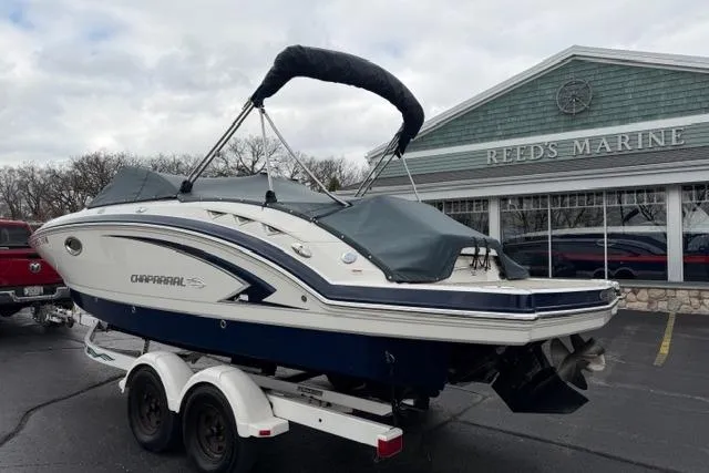 Slide: The Image of 2010 Chaparral Sunesta 244 boat on trailer at Reeds Marine dealership. - 56
