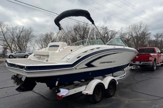 Slide: The Image of 2010 Chaparral Sunesta 244 boat on trailer, parked outdoors on a cloudy day. - 7