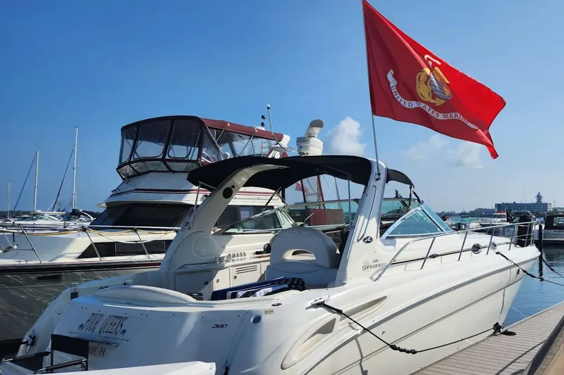 Slide: The Image of 2001 Sea Ray 380 Sundancer with red flag in harbor. - 5
