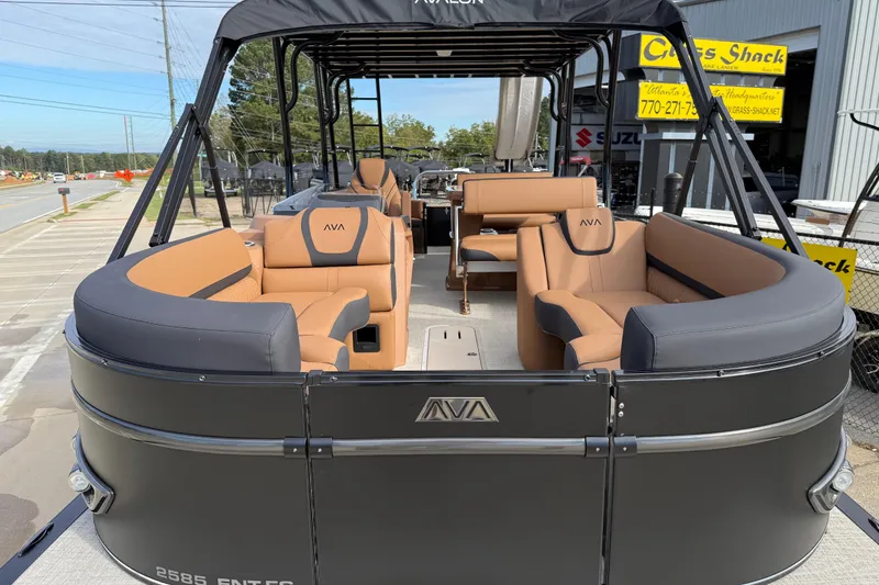 Slide: The Image of 2026 Avalon Catalina Entertainer Funship with luxurious seating, docked at a marina. - 10