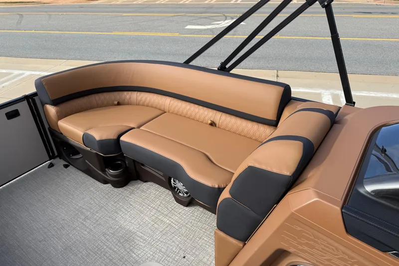 Slide: The Image of Luxurious seating on 2026 Avalon Catalina Entertainer Funship, featuring tan and black upholstery. - 14
