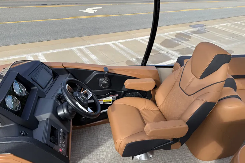 Slide: The Image of 2026 Avalon Catalina Entertainer Funship helm with luxurious tan seating and modern controls. - 19