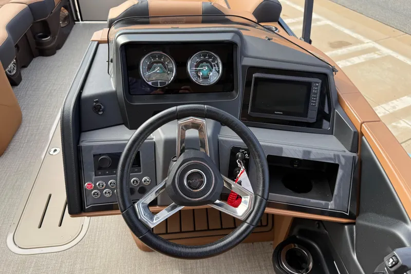 Slide: The Image of 2026 Avalon Catalina Entertainer Funship dashboard with steering wheel, gauges, and navigation system. - 22