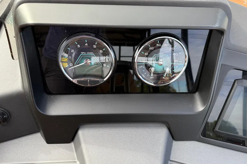 Slide: The Image of Dashboard of 2026 Avalon Catalina Entertainer Funship with RPM and speed gauges. - 23