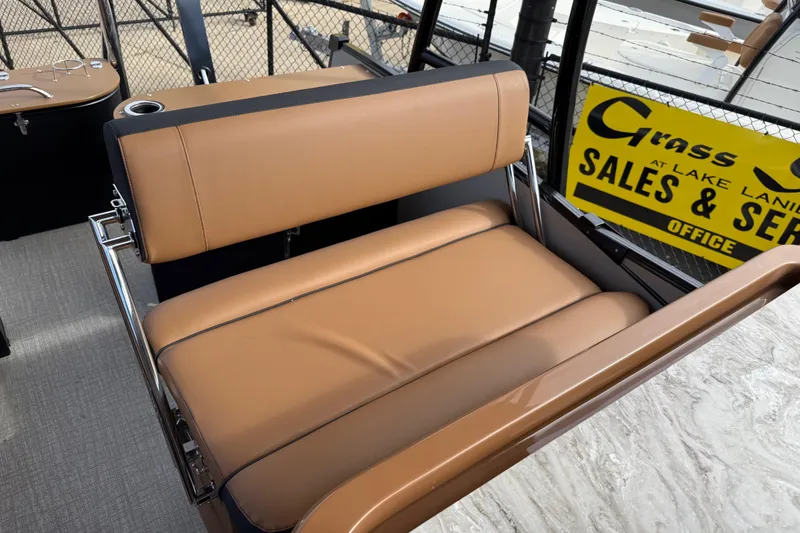 Slide: The Image of 2026 Avalon Catalina Entertainer Funship with tan seating, showcased at a sales office. - 30