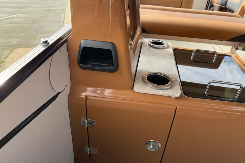 Slide: The Image of Interior of 2026 Avalon Catalina Entertainer Funship with cup holders and storage compartment. - 35