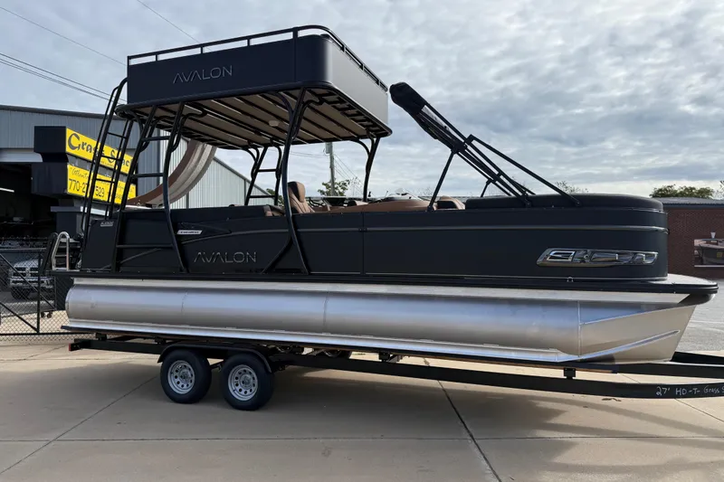 Slide: The Image of 2026 Avalon Catalina Entertainer Funship pontoon boat on trailer, parked outdoors. - 4