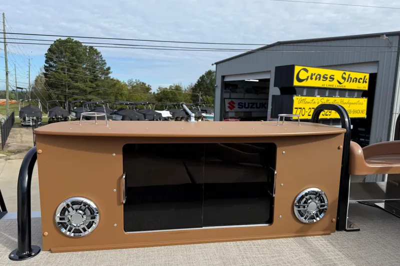 Slide: The Image of 2026 Avalon Catalina Entertainer Funship with outdoor speakers and storage, displayed at dealership. - 48