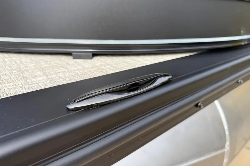 Slide: The Image of Close-up of 2026 Avalon Catalina Entertainer Funship's sleek black cleat on deck. - 58