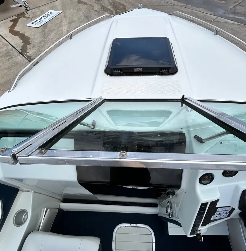Slide: The Image of Interior view of a 1993 Mariah MX20 C boat with control console. - 11