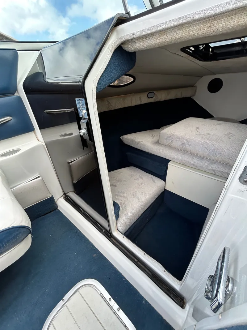 Slide: The Image of Interior of a 1993 Mariah MX20 C boat with sleeping area. - 15