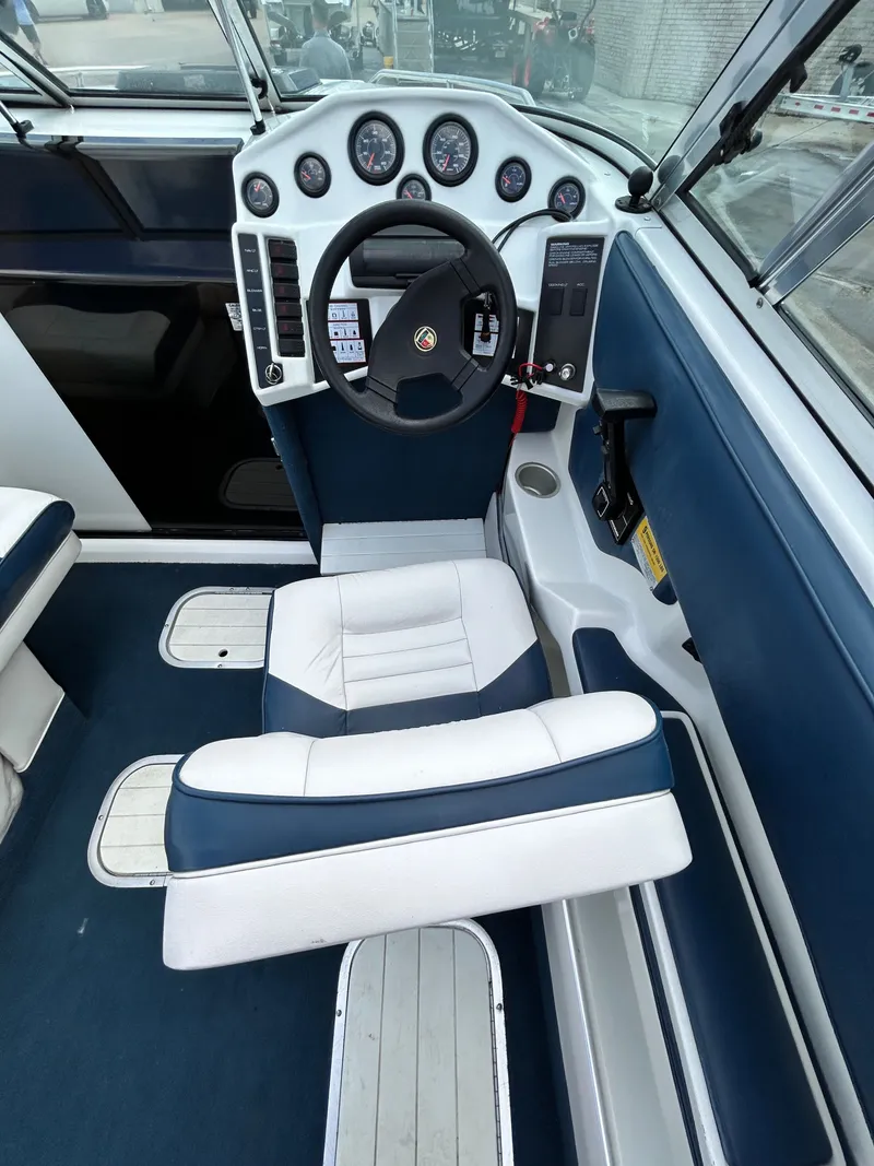 Slide: The Image of Interior of a 1993 Mariah MX20 C boat with steering console. - 18