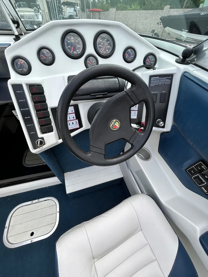 Slide: The Image of 1993 Mariah MX20 C boat steering console with instruments. - 19