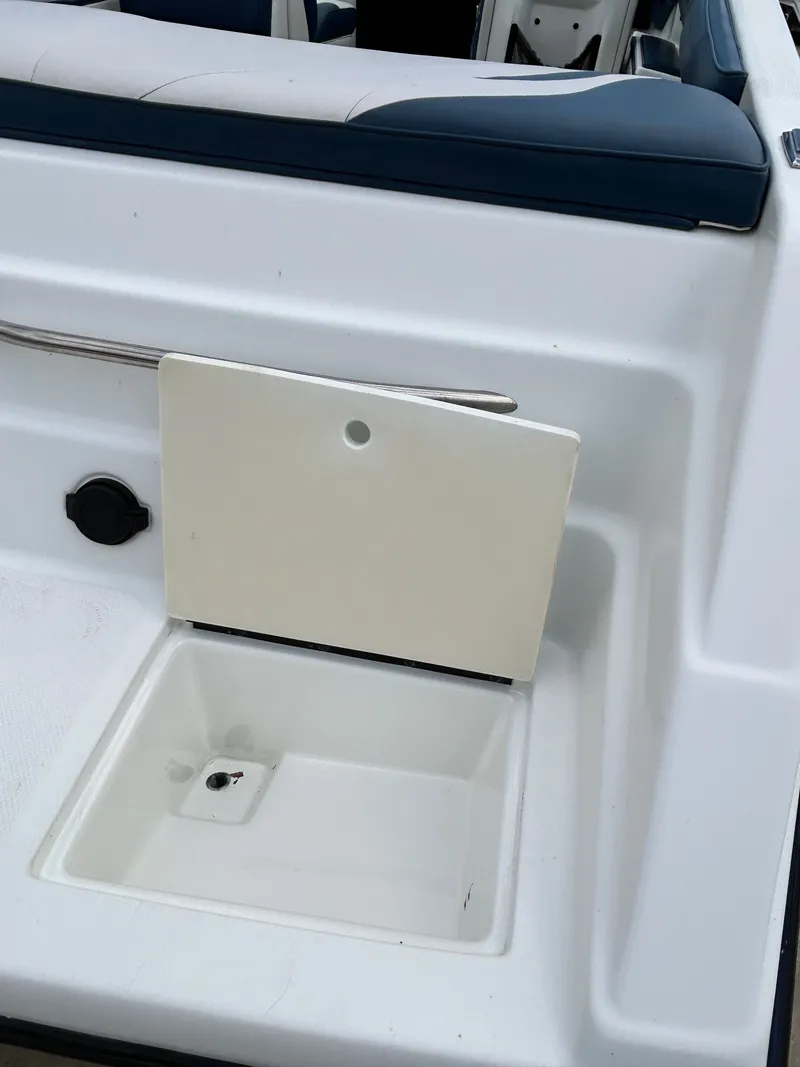 Slide: The Image of Interior of a 1993 Mariah MX20 C boat with storage compartment. - 28