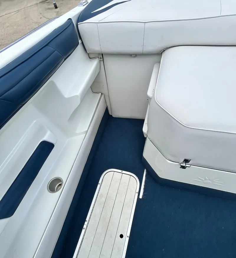 Slide: The Image of Interior of a 1993 Mariah MX20 C boat with blue and white seating. - 33