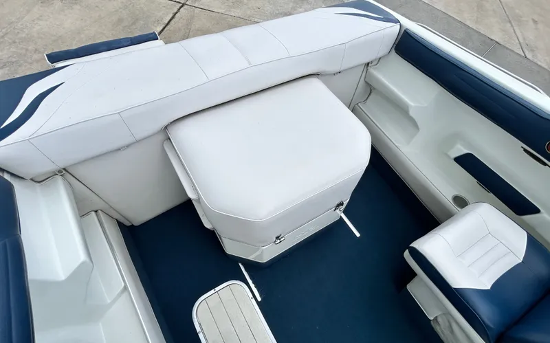 Slide: The Image of Interior of a 1993 Mariah MX20 C boat with white seating. - 34