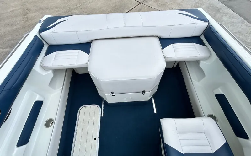 Slide: The Image of Interior of a 1993 Mariah MX20 C boat with blue and white seating. - 38