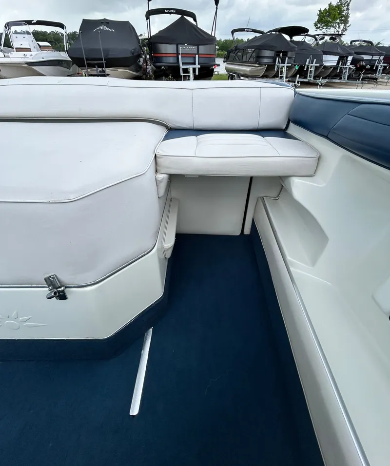 Slide: The Image of Interior of a 1993 Mariah MX20 C boat with blue and white seating. - 39