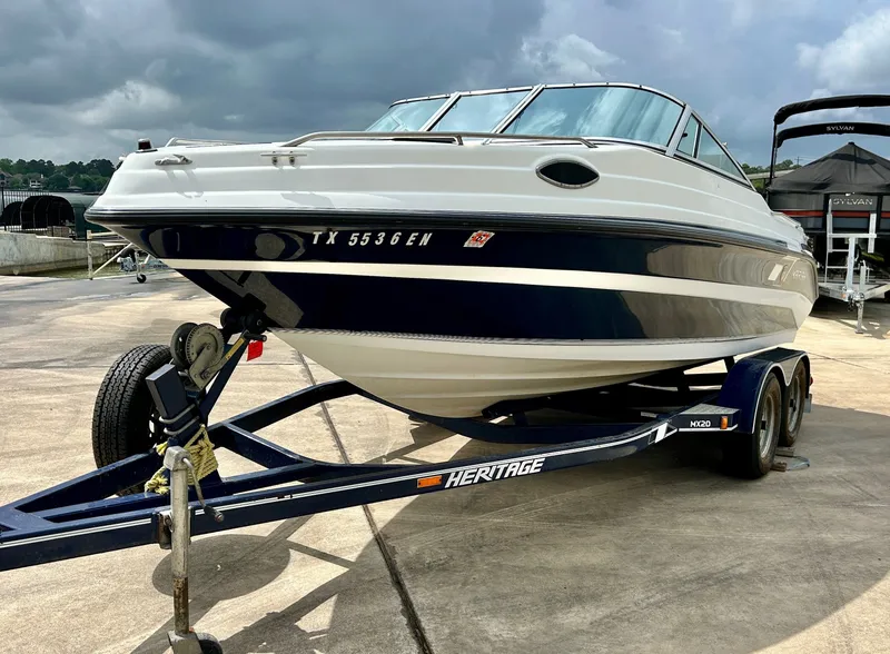 Slide: The Image of 1993 Mariah MX20 C boat on trailer, cloudy sky. - 6