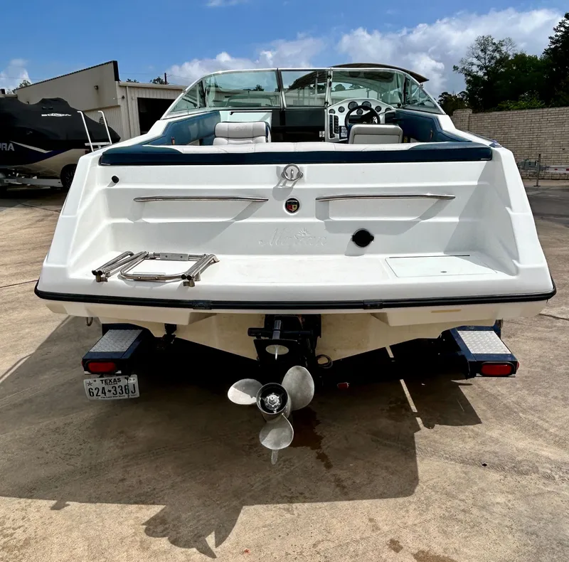 Slide: The Image of Rear view of a 1993 Mariah MX20 C boat on a trailer. - 8